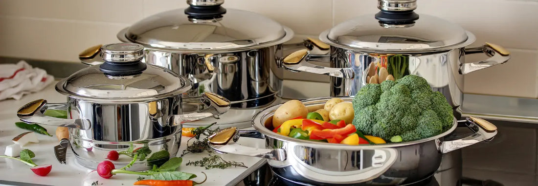 Stainless steel pot and pan set on an induction cooktop in a bright NZ kitchen