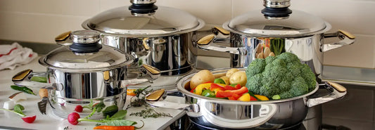 Stainless steel pot and pan set on an induction cooktop in a bright NZ kitchen