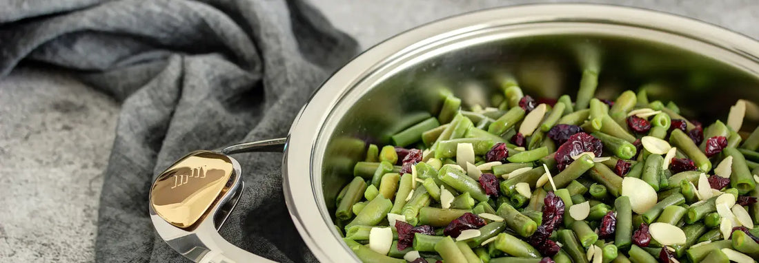 Healthy everyday cooking with a stainless steel pan in a modern New Zealand kitchen