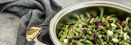 Healthy everyday cooking with a stainless steel pan in a modern New Zealand kitchen