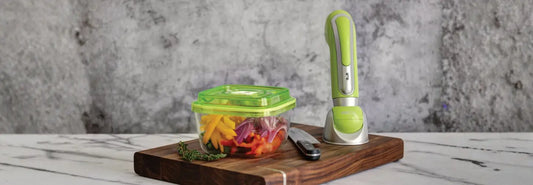 Vacuum sealed food bags with meat and vegetables on a kitchen counter