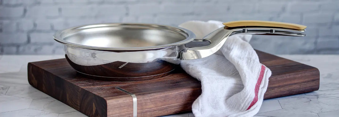 Induction-ready stainless steel pans on a modern induction cooktop in a bright NZ kitchen