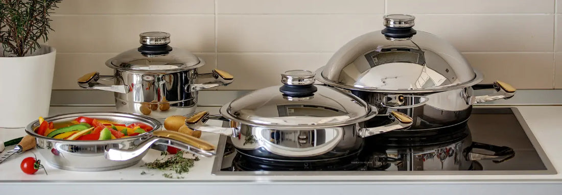 Stainless steel non toxic cookware on a modern NZ kitchen bench with fresh vegetables