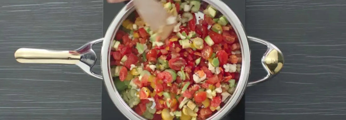 Zepter Masterpiece Cookware frying pan on a modern NZ kitchen hob with fresh ingredients.