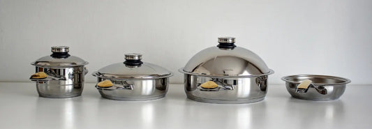 Zepter 24 cm and 30 cm stainless steel woks compared on a flat kitchen cooktop