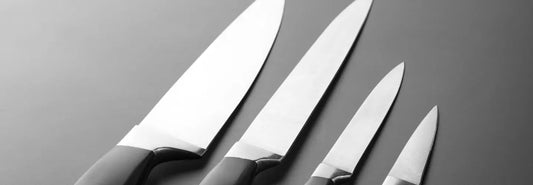 German 18 cm chef's knife with olive wood handle on a wooden chopping board with fresh vegetables.